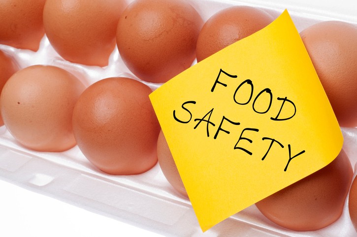 Eggs Can Carry Salmonella Food Safety Concept Concept with Brown Egg and Yellow Note.